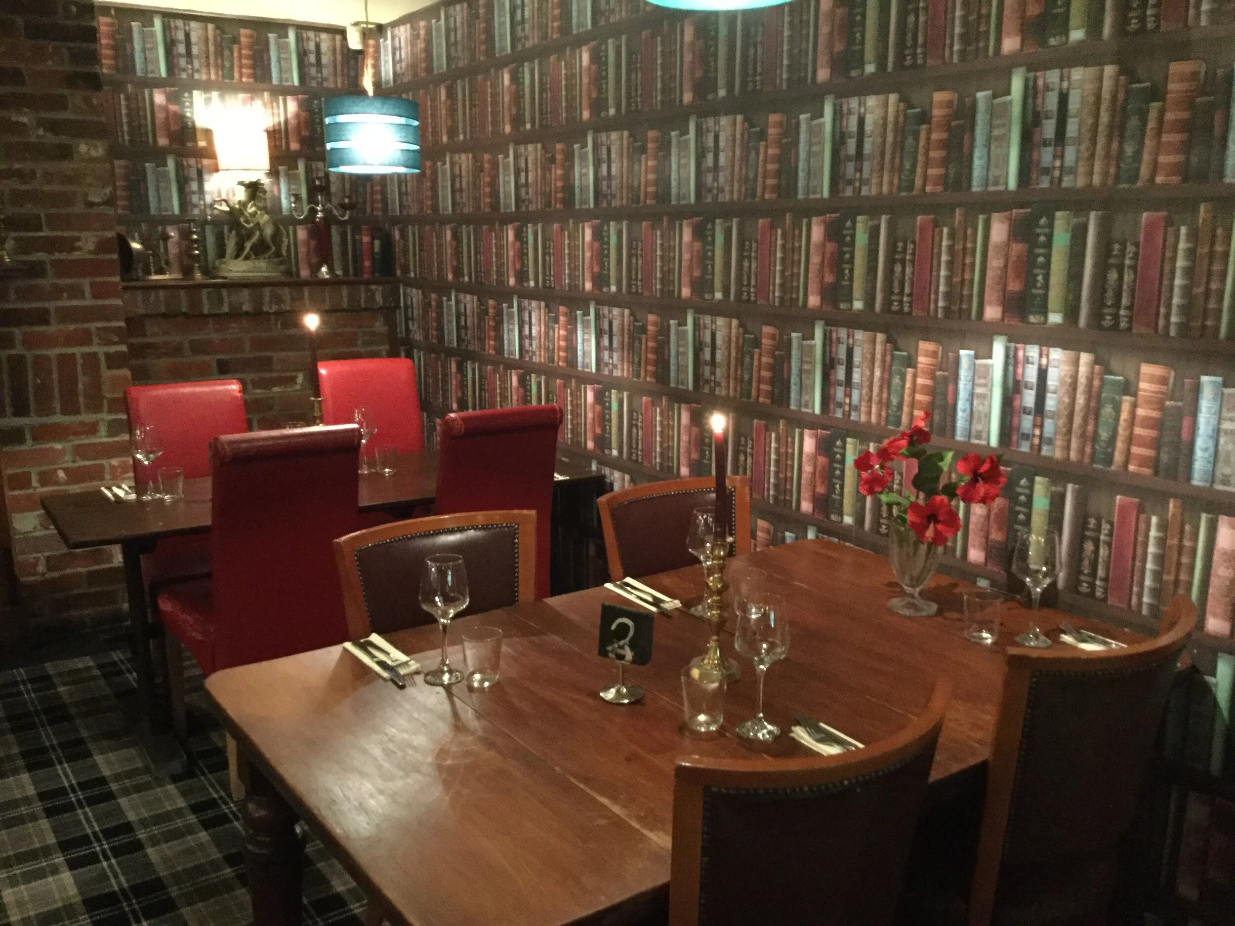 The library snug with candlelit tables